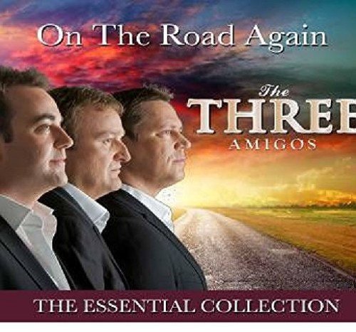 "CD cover featuring three men in suits on a road at sunset."