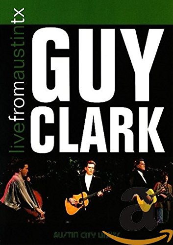 The image shows a man singing into a microphone. Alt text: Man singing into a microphone on a concert DVD cover.