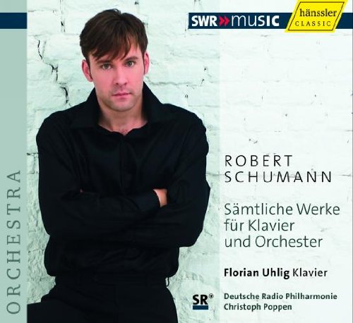 CD cover with a man standing against a white brick wall, text in German.