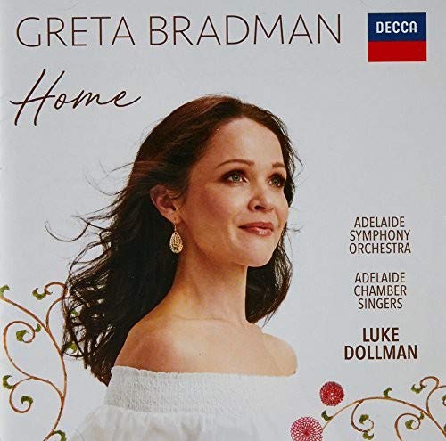 Greta Bradman's "Home" CD cover featuring a woman in white with flowing dark hair.