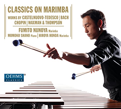 "CD cover featuring a man playing marimba, with gold text and white background."