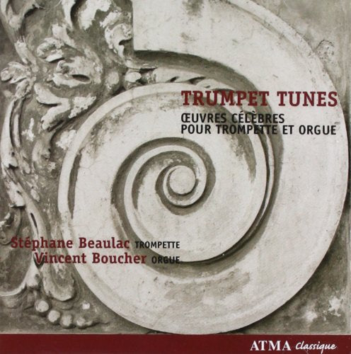 "CD cover with ornate stone spiral design, red and black text, and red banner."