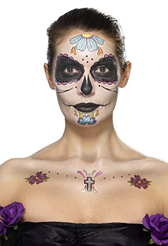 Woman with Day of the Dead face paint and temporary tattoos on her face and chest.