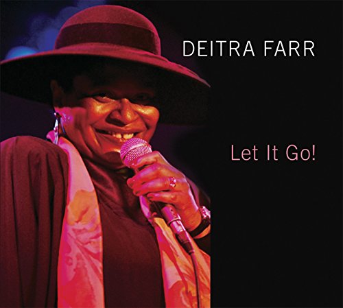 Woman in hat holding microphone with text "Deitra Farr Let It Go!" on black background.