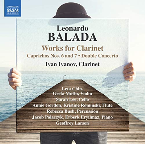 A person holding a CD cover with text and a wooden dock image.