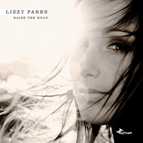 "Album cover featuring a black and white close-up of a woman's face."