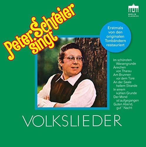 "CD cover with a man standing by a tree, green background, yellow and white text."