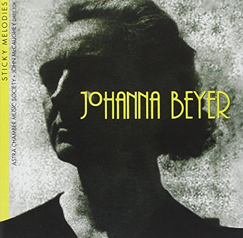 "Album cover featuring a black and white portrait with the artist's name in yellow."