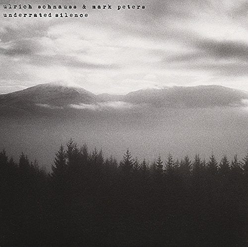 Black and white album cover with misty mountains and trees, artist names at top.