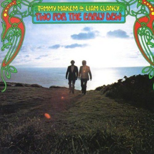 "Album cover with two men walking on a cliff, ocean in the background."