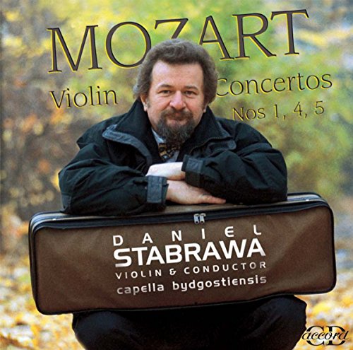 Man crouching with violin case, outdoors with autumn foliage, on a CD cover.