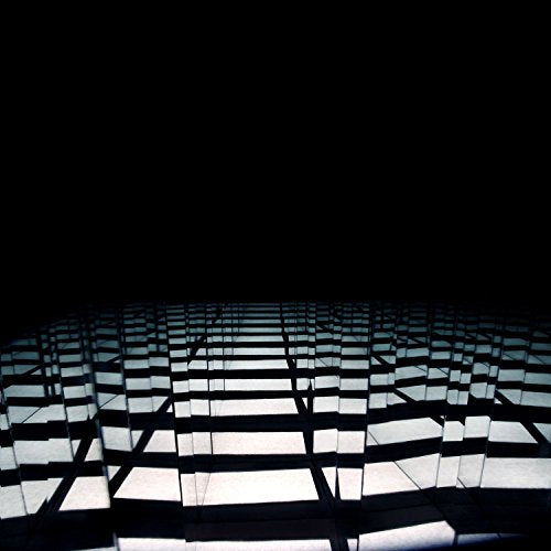 A CD case with a grid pattern and shadows on a black background.