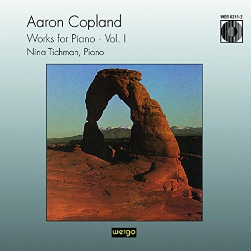 CD cover with a rock arch and blue sky on a gradient background.