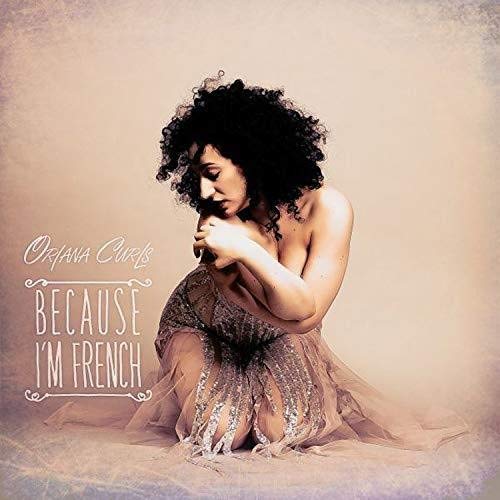 Oriana Curls album cover featuring a woman in a dress, kneeling with head bowed.