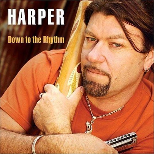"CD cover featuring a man holding a harmonica, wearing an orange shirt."