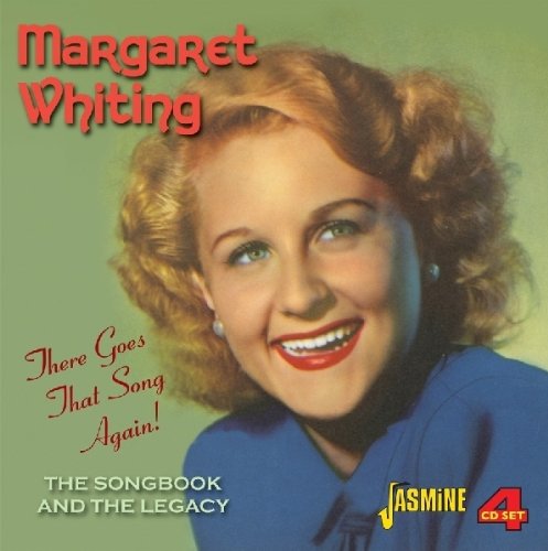 CD cover featuring a smiling woman with red hair and blue shirt.