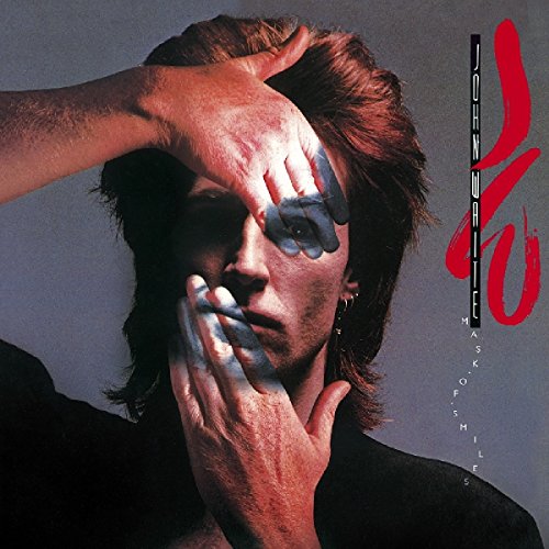 "Album cover featuring a man with paint on his face and hands."
