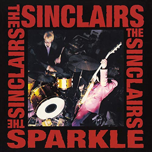 Album cover with red text and a photo of two musicians performing.