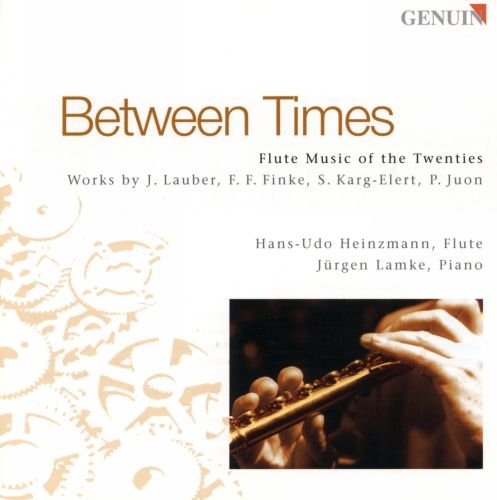"CD cover with 'Between Times' title, featuring a person playing a flute."
