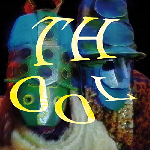 "Album cover with two masked figures and the text 'TH OOL' in yellow."