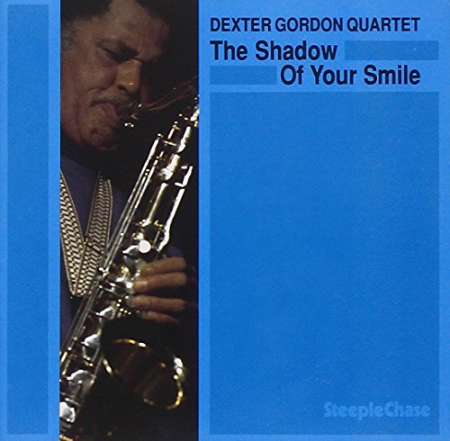 Dexter Gordon playing saxophone on a blue album cover with title and artist name.