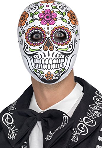 Man wearing a white sugar skull mask with floral designs and black clothing.