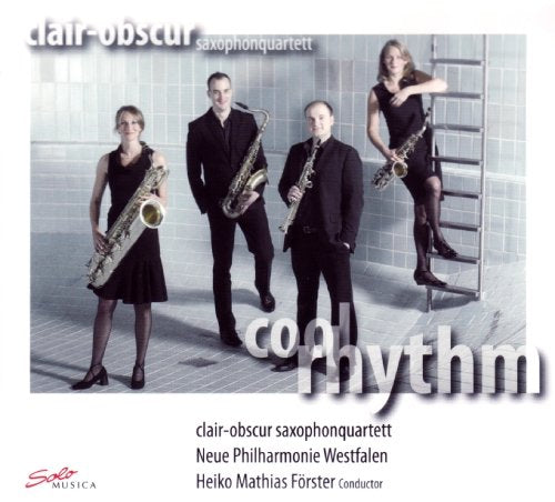 Four musicians in black outfits holding saxophones pose in a tiled room.