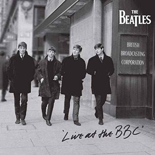 "Black and white CD cover of The Beatles walking outside the BBC building."