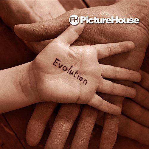 "Album cover with 'Evolution' written on a child's palm, held by an adult's hand."