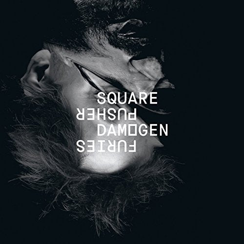 Black and white image of a man's face with text overlay, upside down and backwards.