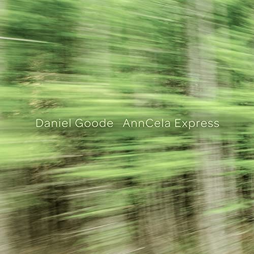 "Blurry green forest image with white text 'Daniel Goode AnnCela Express' in the center."