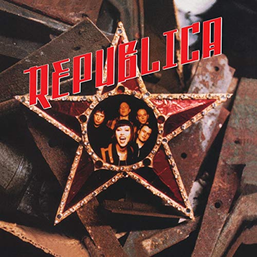 "Album cover featuring a gold star with band members inside, on rusty metal."