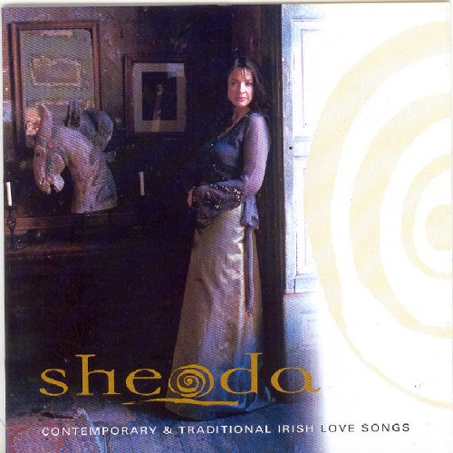"CD cover featuring a woman in a long, shiny dress standing in a doorway."