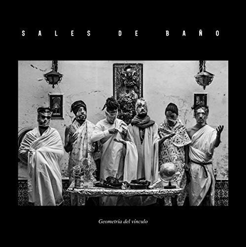 "Black-and-white vinyl album cover featuring six people in robes around a table."