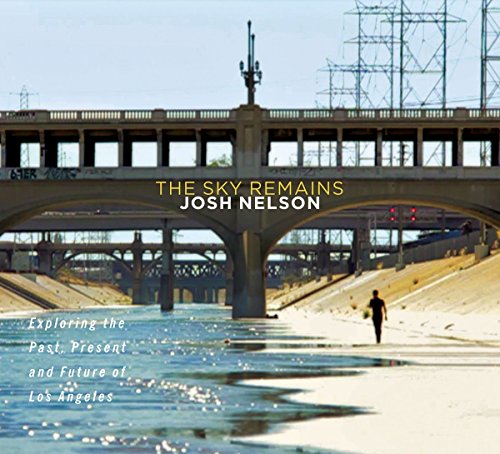 "Album cover with a person walking under a bridge, with text overlay."