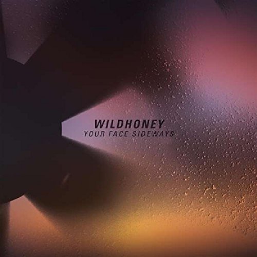 "CD album cover with 'Wildhoney - Your Face Sideways' text on a misty, lit background."