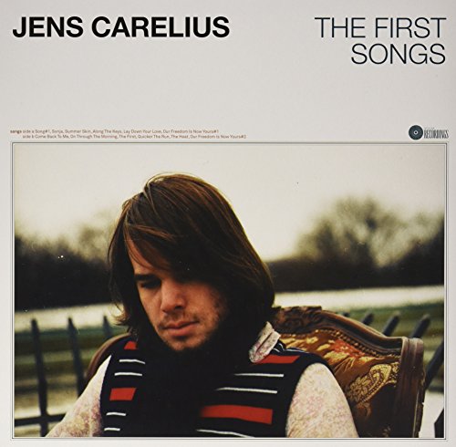 Vinyl album cover with a man sitting in a chair, outdoors.