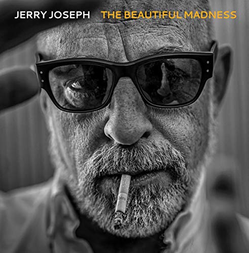 "Album cover: black-and-white portrait of a man wearing sunglasses and smoking a cigarette."