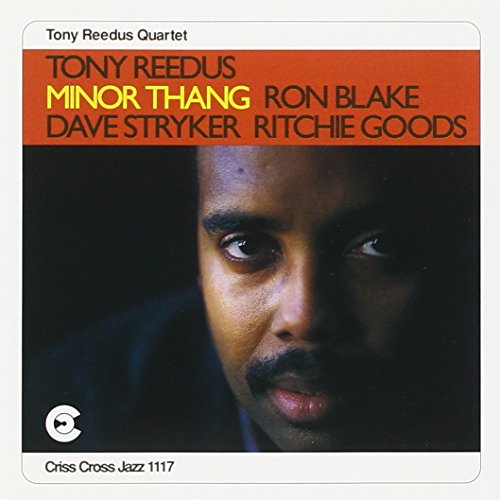 "Tony Reedus album cover with a man's face and red title banner."