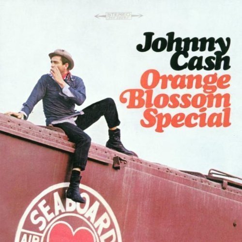 Johnny Cash album cover featuring a man sitting on a red train car.
