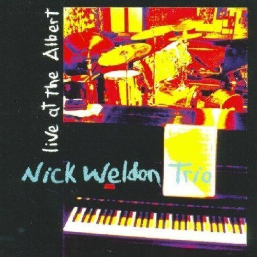 "Album cover featuring a drum kit and keyboard on a black background."