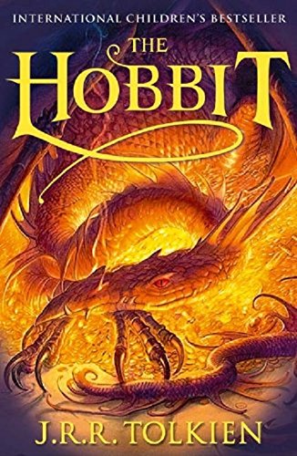 The image depicts the cover of a book titled "The Hobbit" by J.R.R. Tolkien, featuring a large golden dragon surrounded by flames and smoke, with the title and author's name prominently displayed in yellow text. Alt text: "Book cover of 'The Hobbit' with a golden dragon and flames."