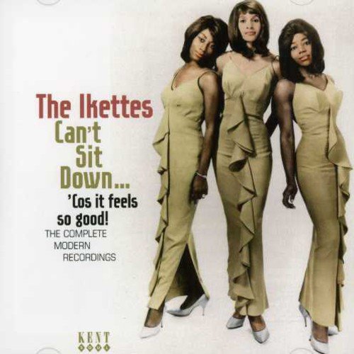 "Album cover featuring three women in matching beige dresses and heels."