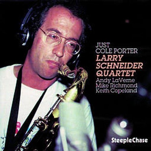 CD cover featuring a man playing saxophone, wearing headphones, against a dark background.