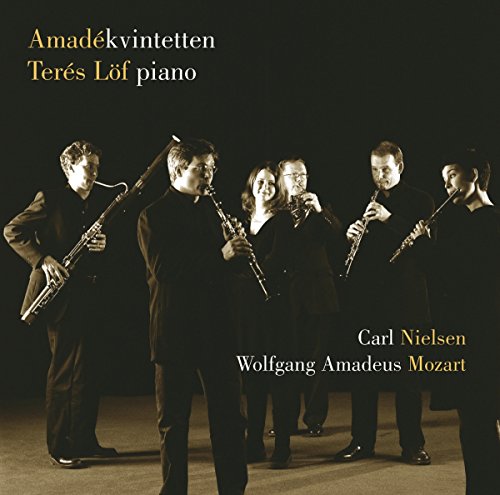 "CD cover featuring a group of musicians playing wind instruments in black attire."