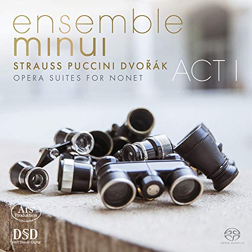 "CD cover with brass instruments on a concrete surface, gold and white text."