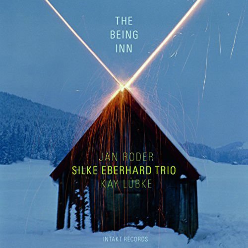 Snow-covered wooden barn with sparks and light beams, album cover for "The Being Inn".