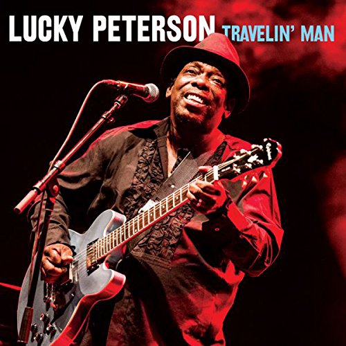 "Lucky Peterson album cover featuring a man playing guitar and singing into a microphone."