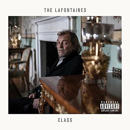 "Album cover with a man in a dark room, 'Parental Advisory' label."