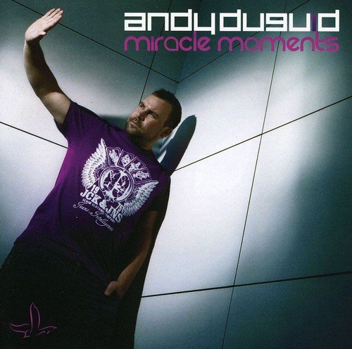 Man in purple shirt leaning against wall, with text "andy duguid miracle moments" above.